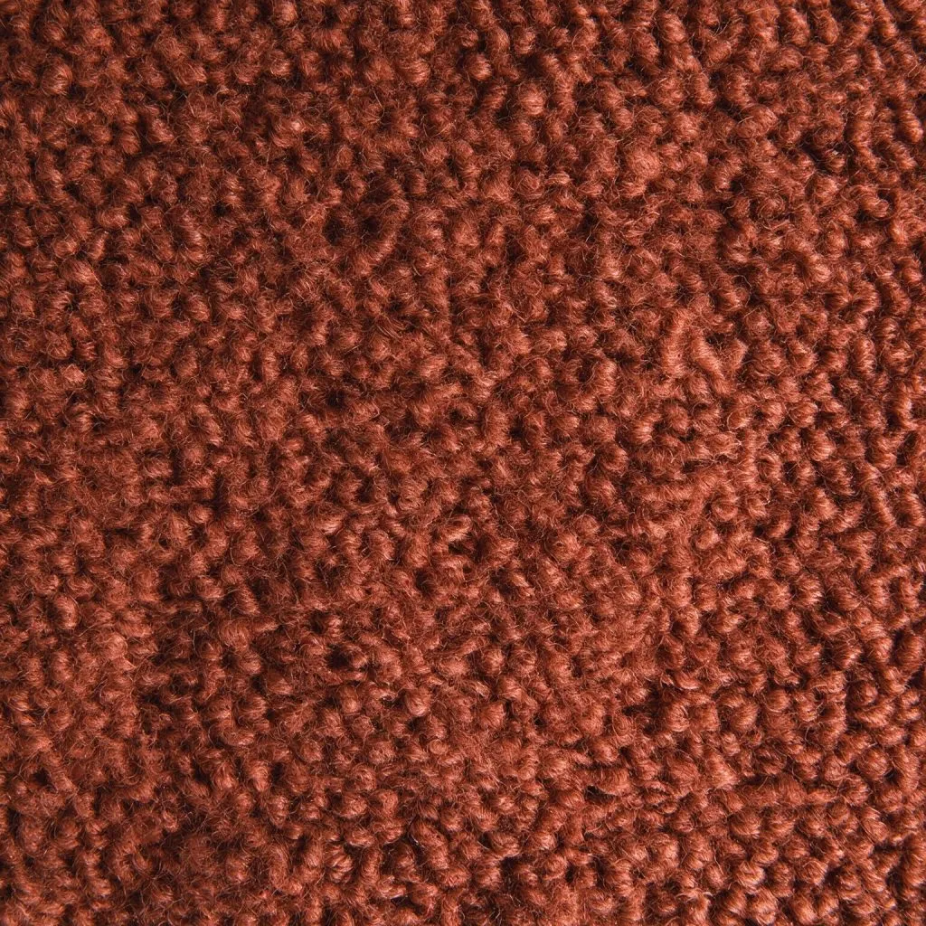 Close-up of rust-brown wool bouclé fabric with a looped texture.